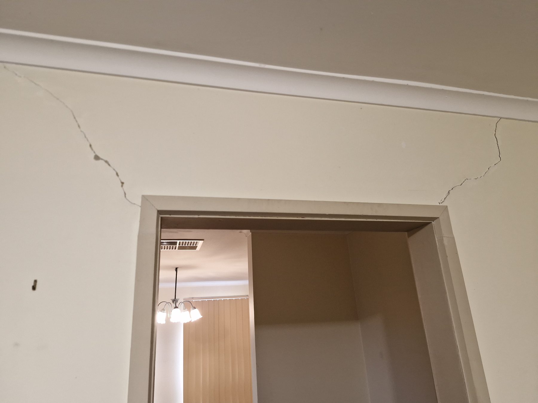Internal wall cracking above a doorway